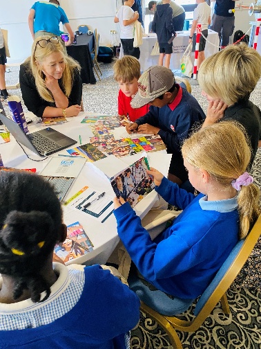 A group of kids sitting around a table

AI-generated content may be incorrect.