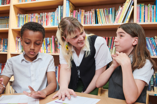 young people in classroom with teacher