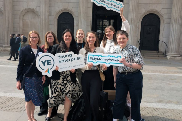 YE staff with my money week signs