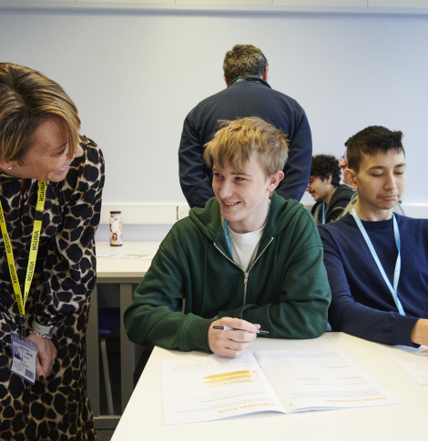 Volunteer speaking to young person