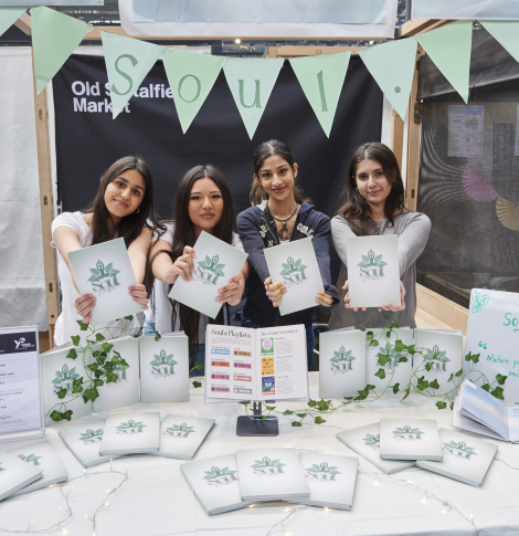 group of students at trade stand 