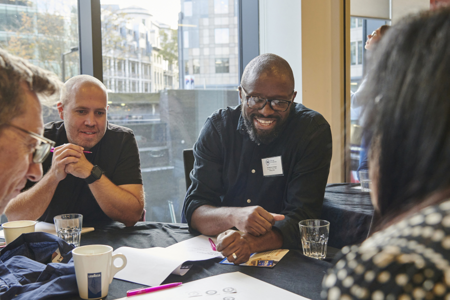 Group of people sitting down.