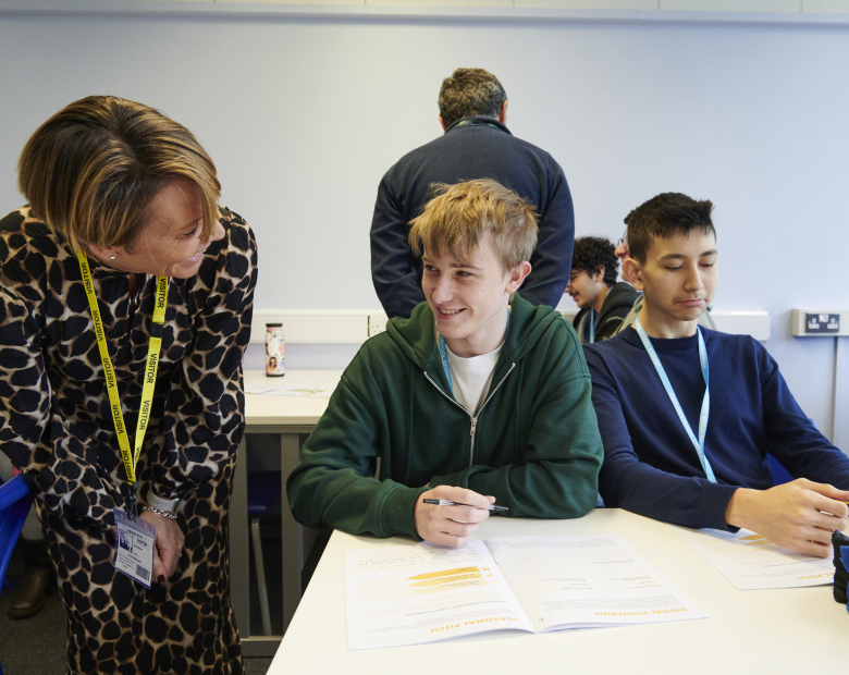 Volunteer speaking to young person