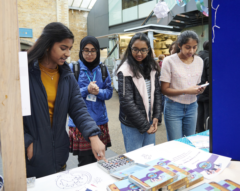group of students at trade stand 